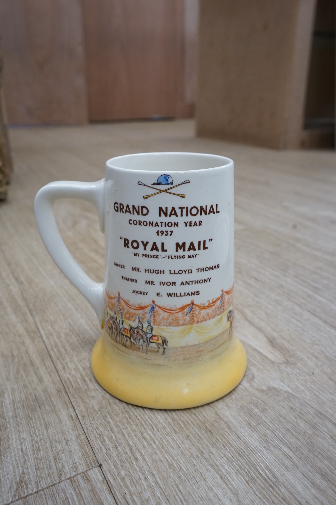 A quantity of plated cutlery, a Royal Doulton limited series sporting mug by Teofani and an Aynsley plate, 27.5cm diameter.